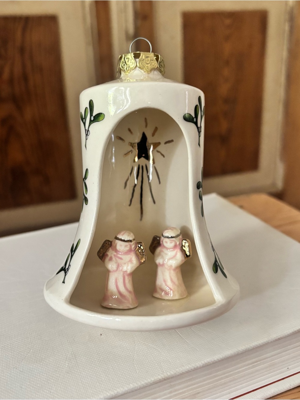 White Ceramic Bell Ornament with Pink Angel Figurines